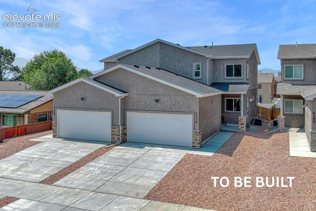 Image 1 of 28: Desirable stucco exterior and low maintenance xeriscaped front yard.