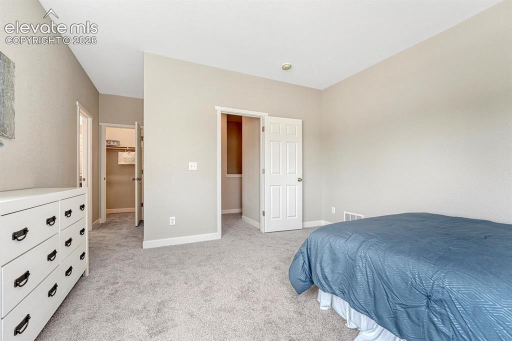 Image 10 of 28: A walk-in closet and secondary closet provide ample space for your wardrobe