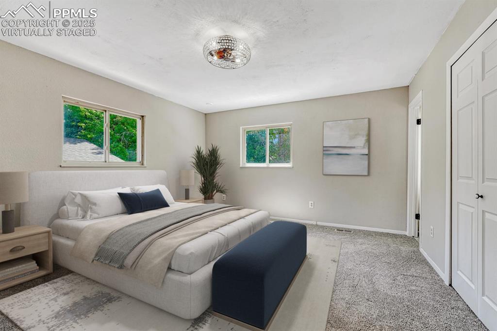 Image 15 of 50: Primary bedroom virtually staged