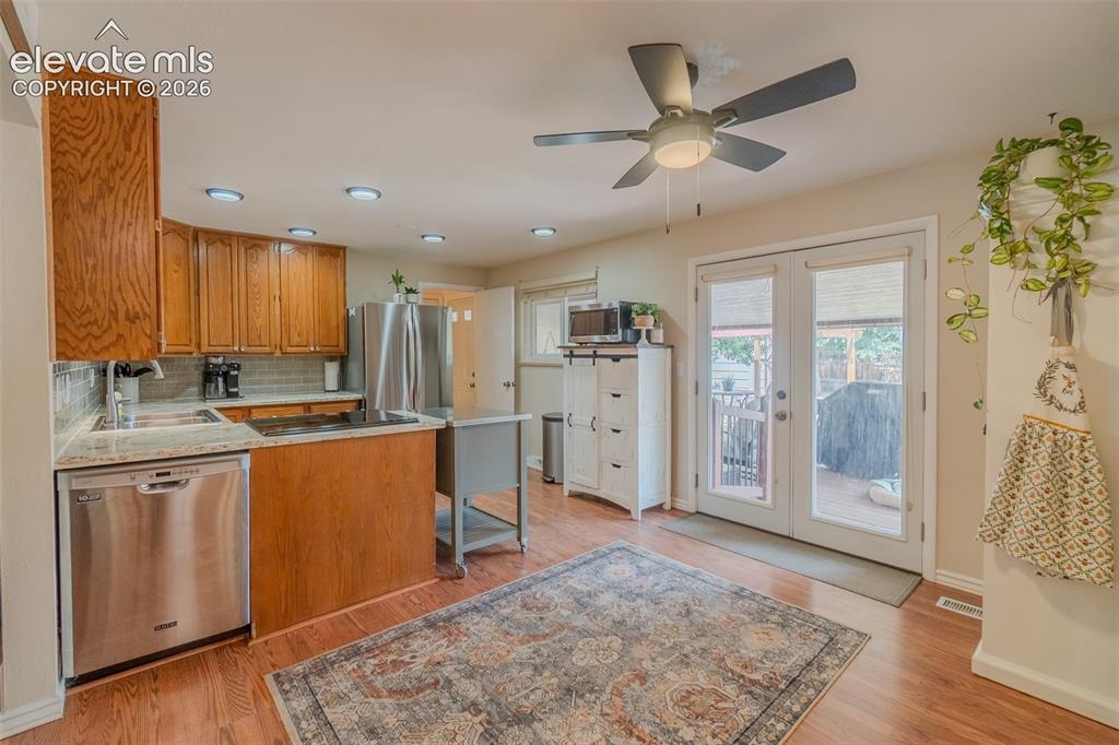 Image 18 of 46: Interior space featuring wood-finish flooring, light neutral wall tones, an