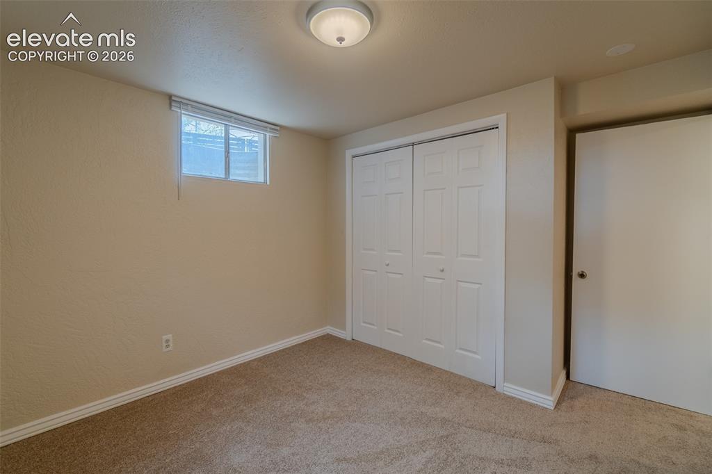 Image 33 of 46: Neutral-toned walls complement the new carpet.