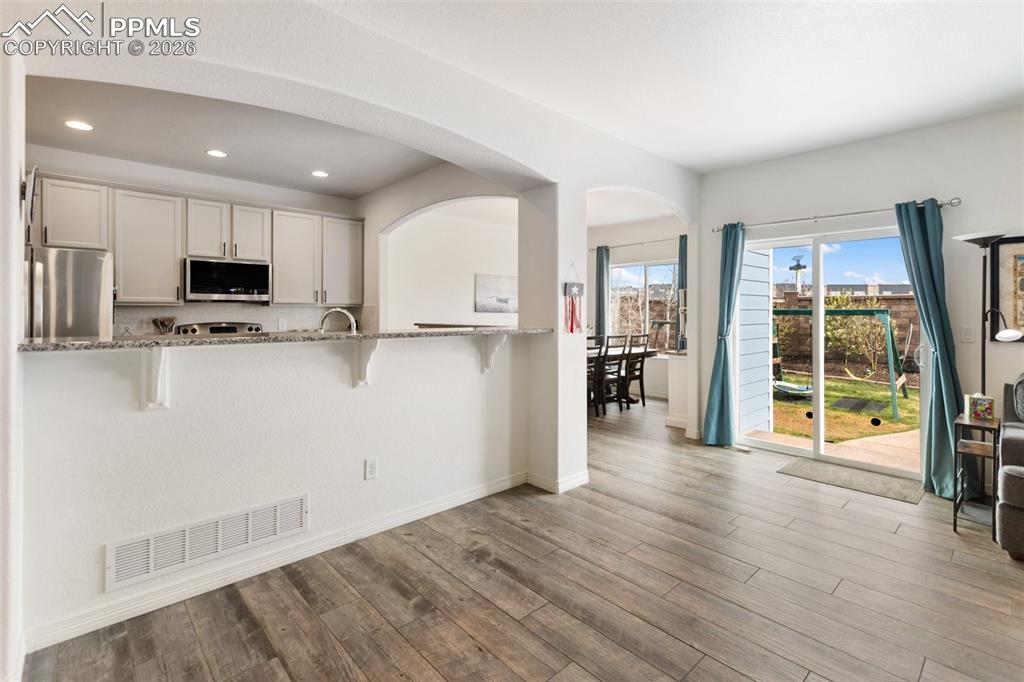 Image 12 of 34: A flowing layout from one room to the next