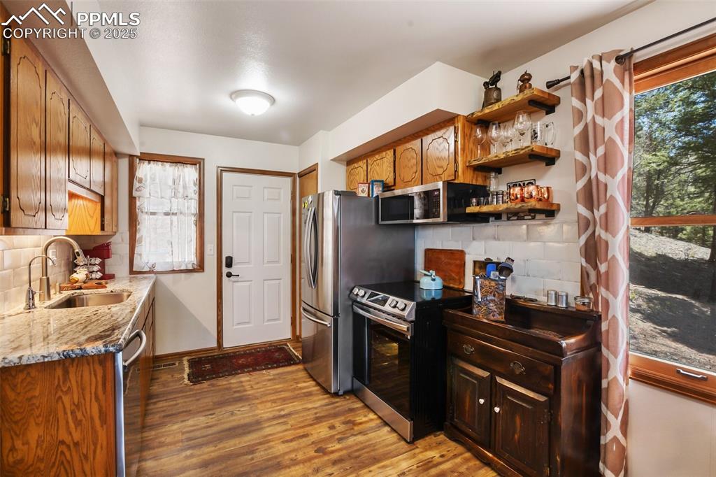 Image 12 of 49: Kitchen featuring stainless s