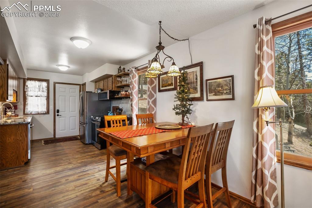 Image 13 of 49: Dining area looking into kitchen