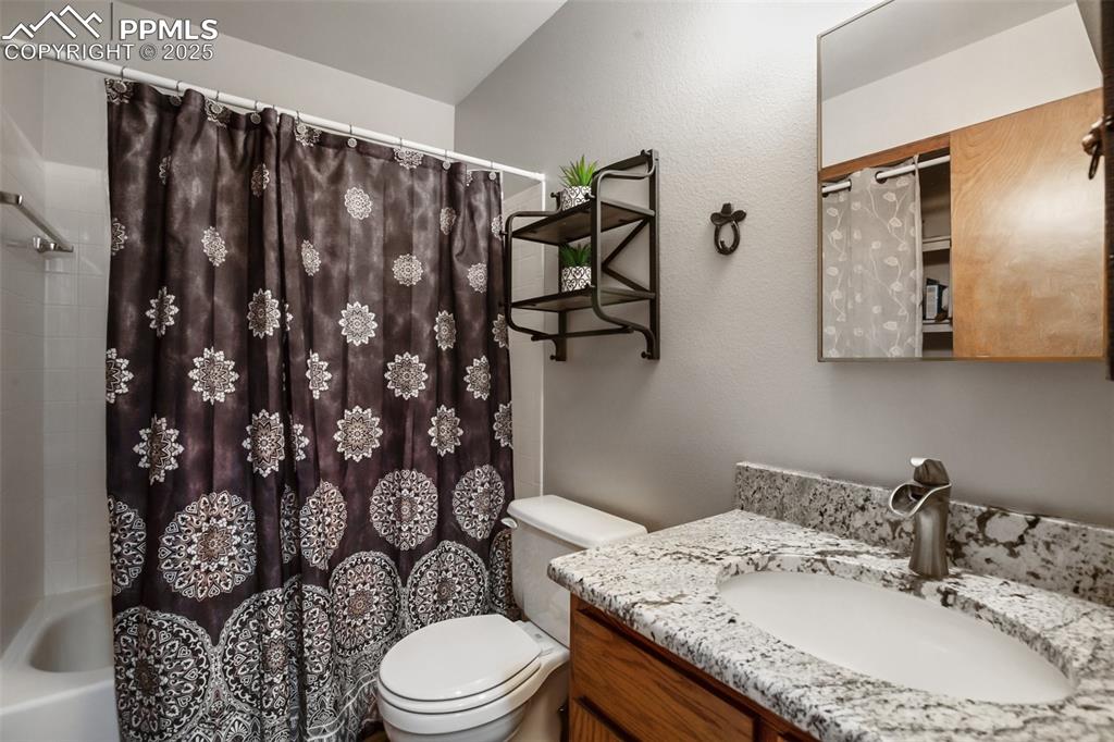 Image 19 of 49: Main level bath
