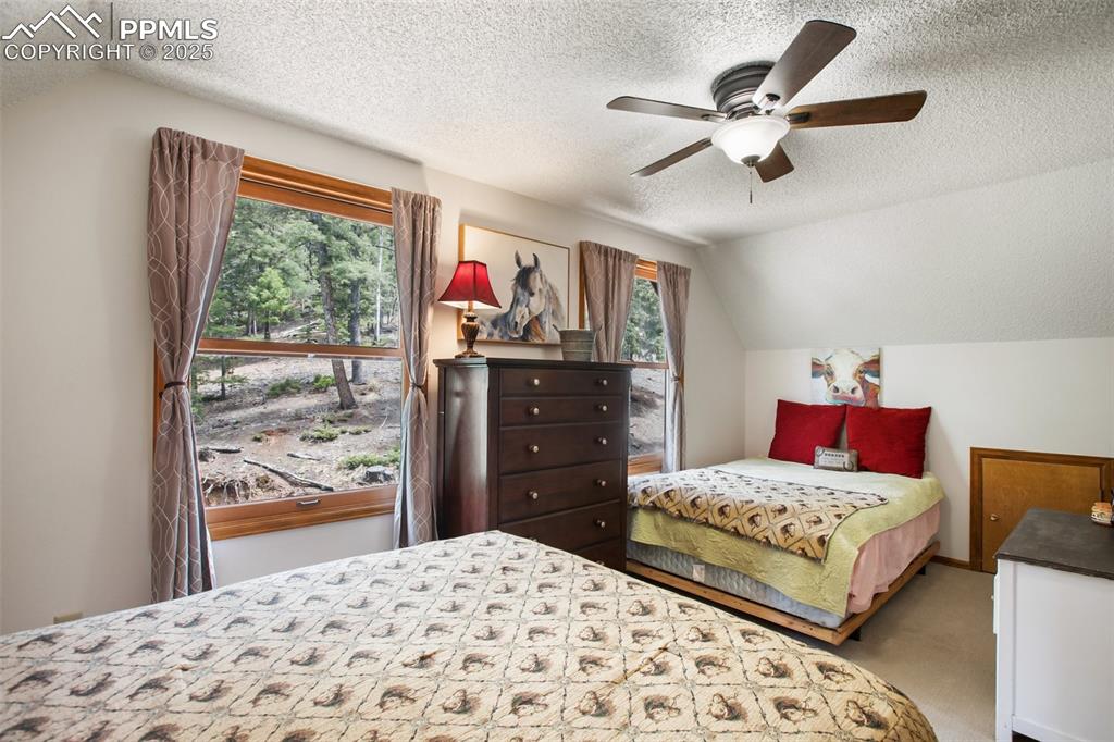 Image 24 of 49: Large bedroom on upper level easily fits two beds