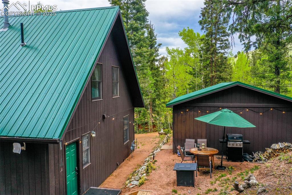 Image 49 of 49: View of side of property with metal roof