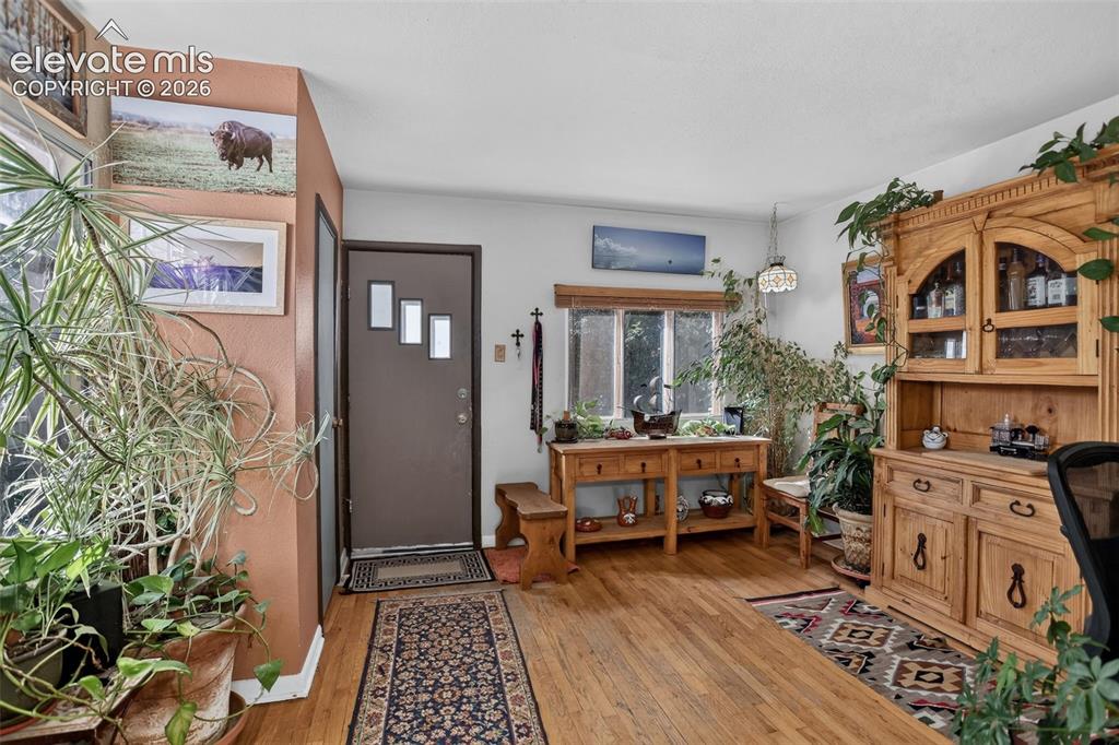 Image 14 of 25: Hardwood flooring extends throughout