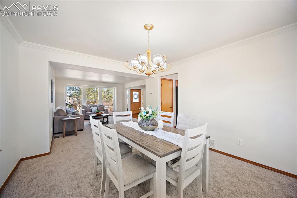 Image 9 of 44: Formal dining just off the kitchen and open to the formal living. Great for