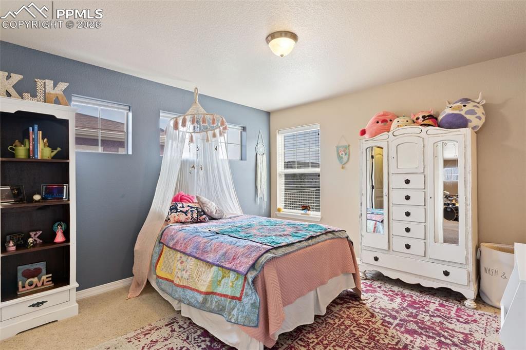 Image 24 of 45: Upper level bedroom