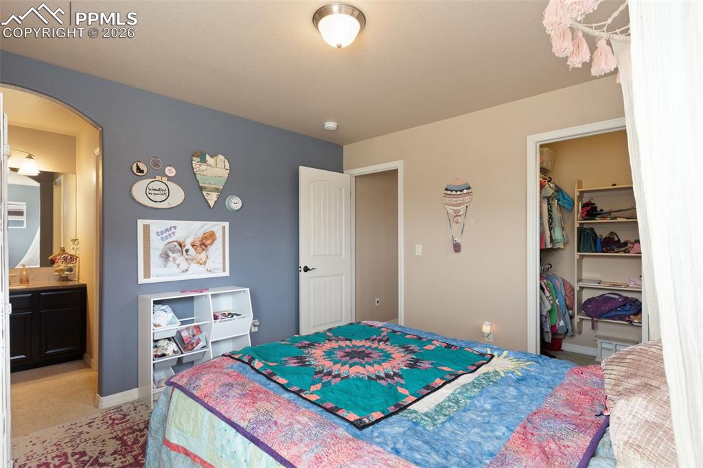 Image 25 of 45: Upper level bedroom