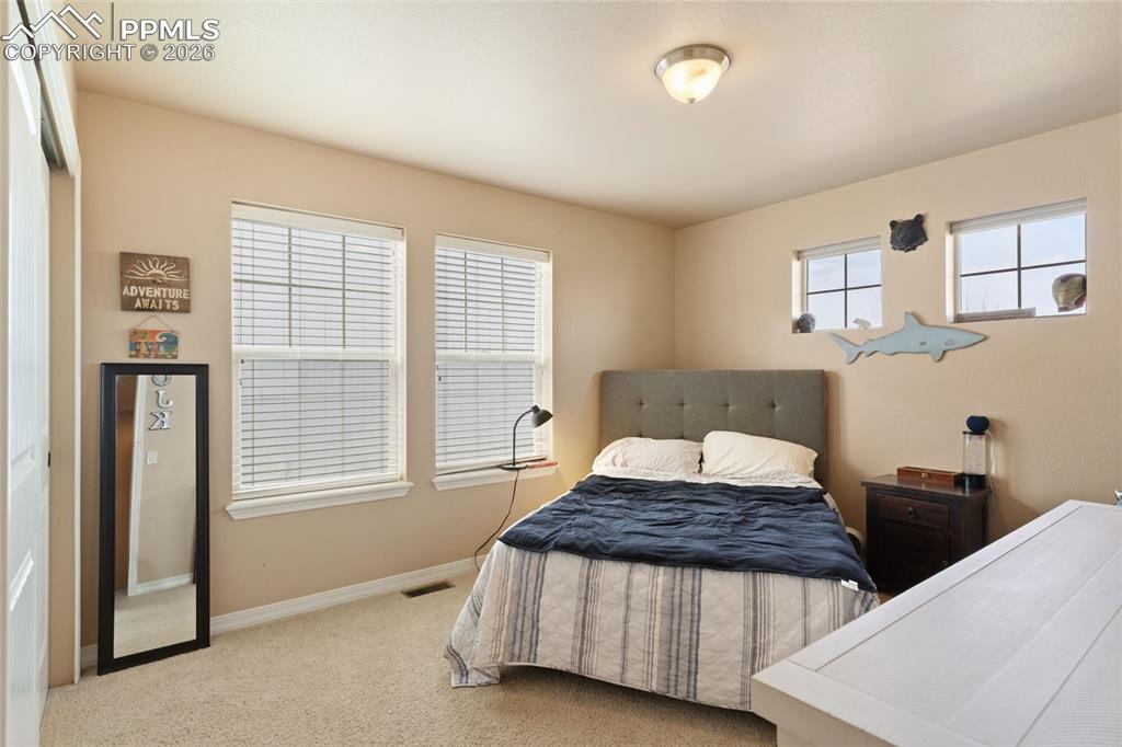 Image 28 of 45: Upper level bedroom