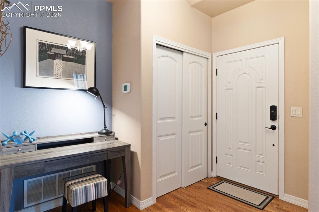 Image 6 of 45: The nook in the entry provides a cozy space for a desk, bench, or table