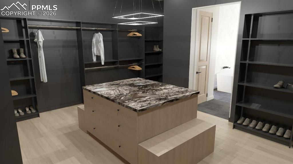 Image 20 of 45: Primary dressing room with built-ins