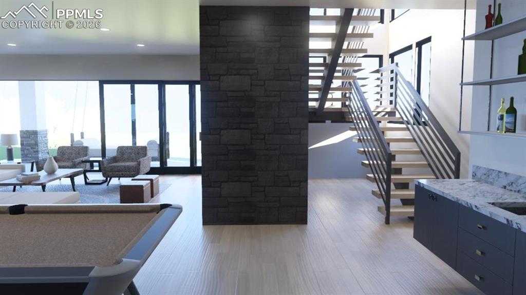 Image 21 of 45: Lower level family room, rec room, and bar