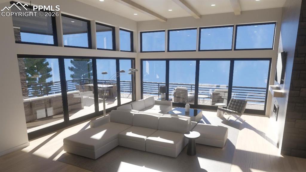 Image 5 of 45: Living room with a high ceiling, beams, and dual 20
