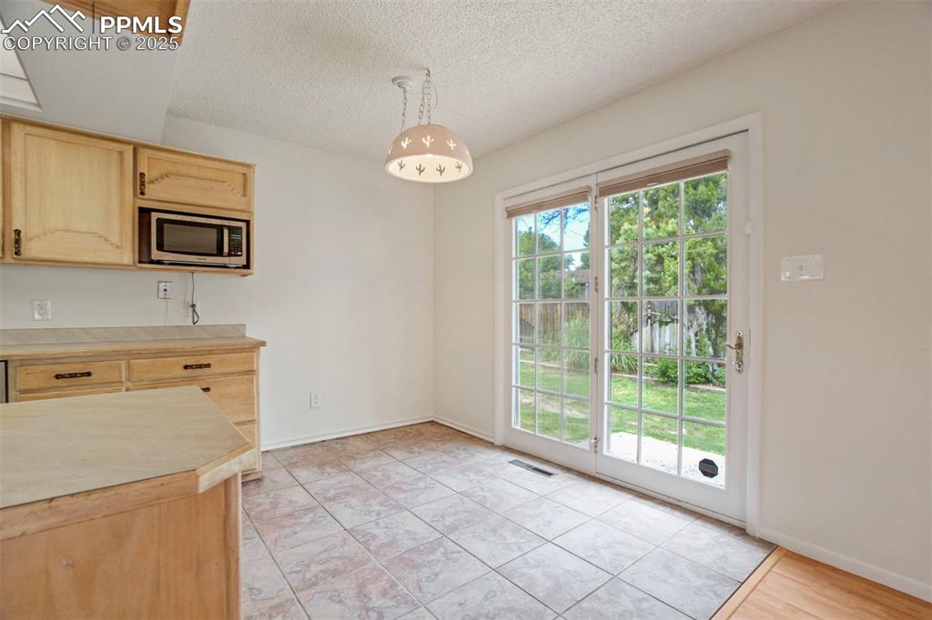 Image 11 of 45: Dining area adjacent to the kitchen