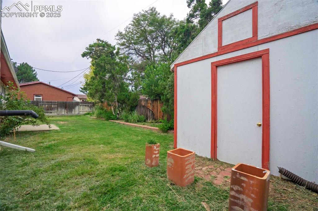 Image 43 of 45: View of yard with a storage shed