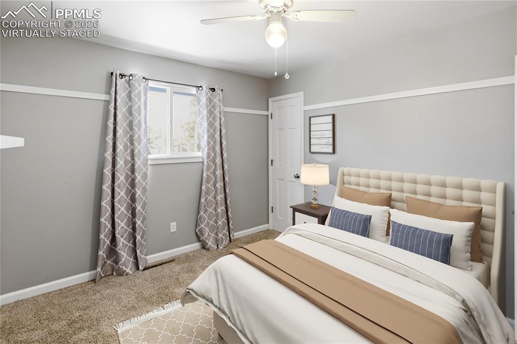 Image 20 of 42: Main Level Bed 2 - Virtually Staged