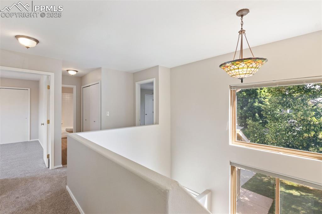 Image 13 of 31: Corridor with carpet flooring