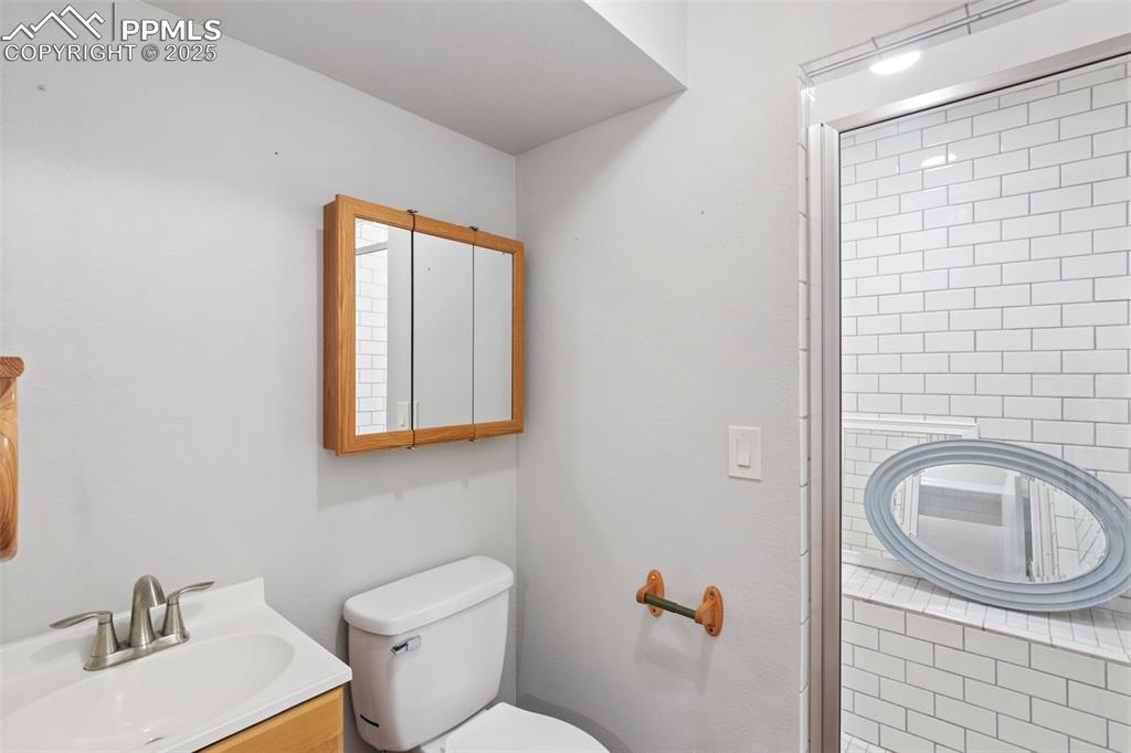 Image 17 of 31: Full bathroom with vanity and a shower