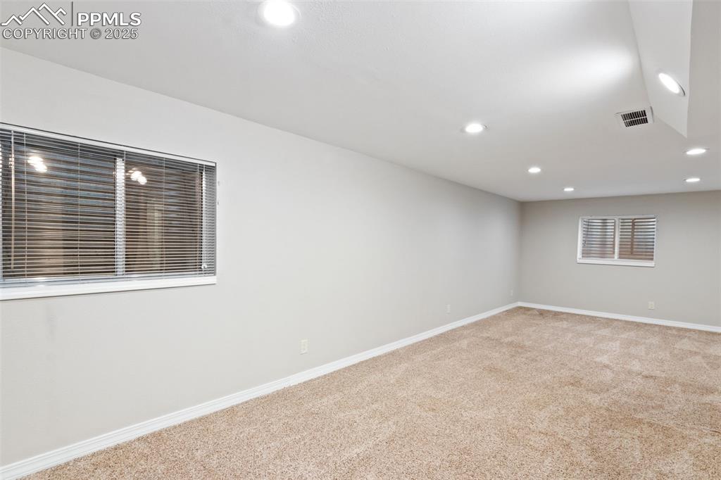 Image 24 of 31: Unfurnished room featuring recessed lighting and light colored carpet
