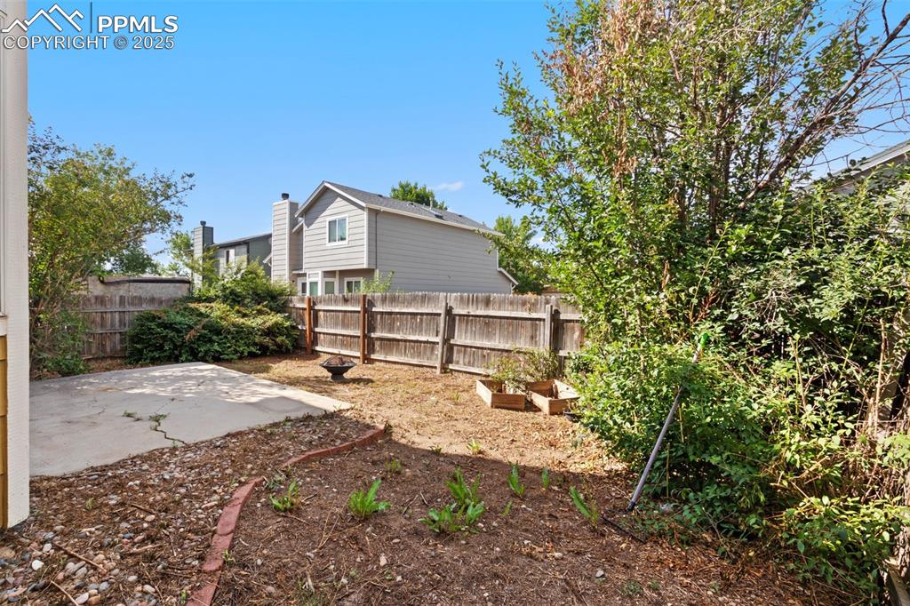 Image 25 of 31: Fenced backyard featuring a patio area