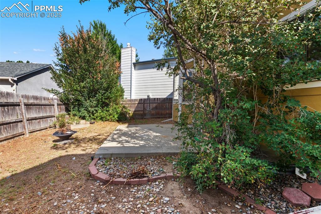 Image 26 of 31: Fenced backyard featuring a patio area