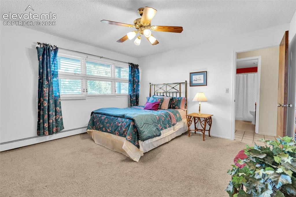 Image 41 of 50: Main level bedroom.