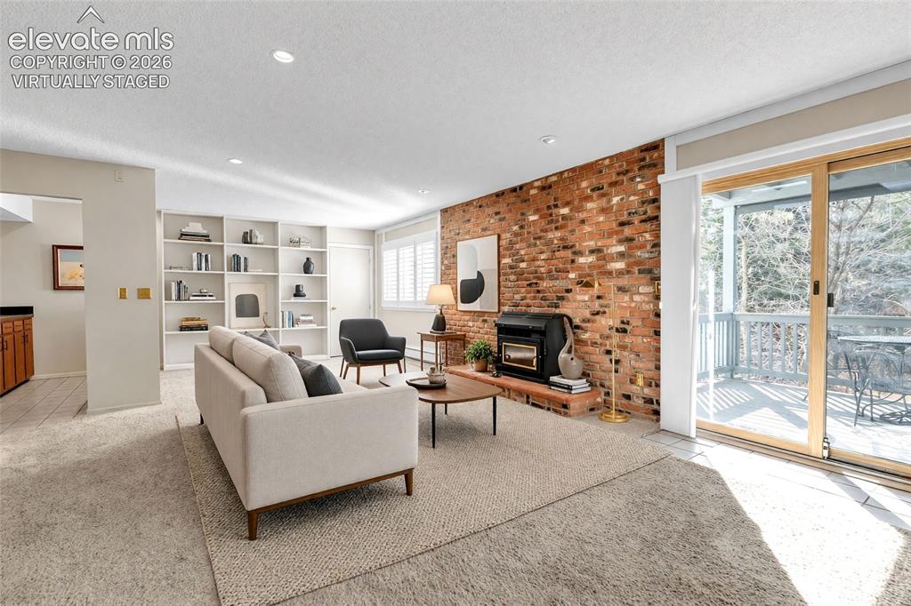 Image 6 of 50: Virtually staged. Family room reimagined with current architectural details