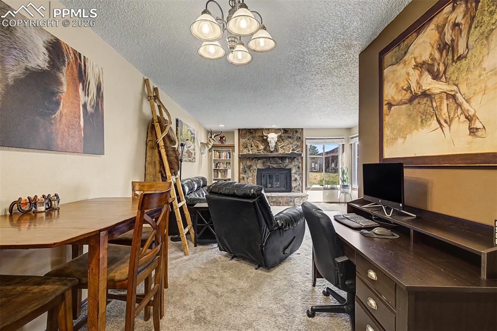Image 10 of 23: The spacious living room flows effortlessly  offering a versatile and invit