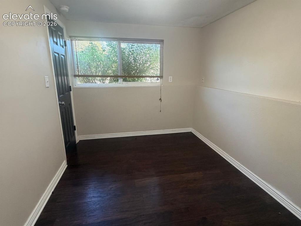 Image 12 of 18: Well sized bedroom with LVT flooring