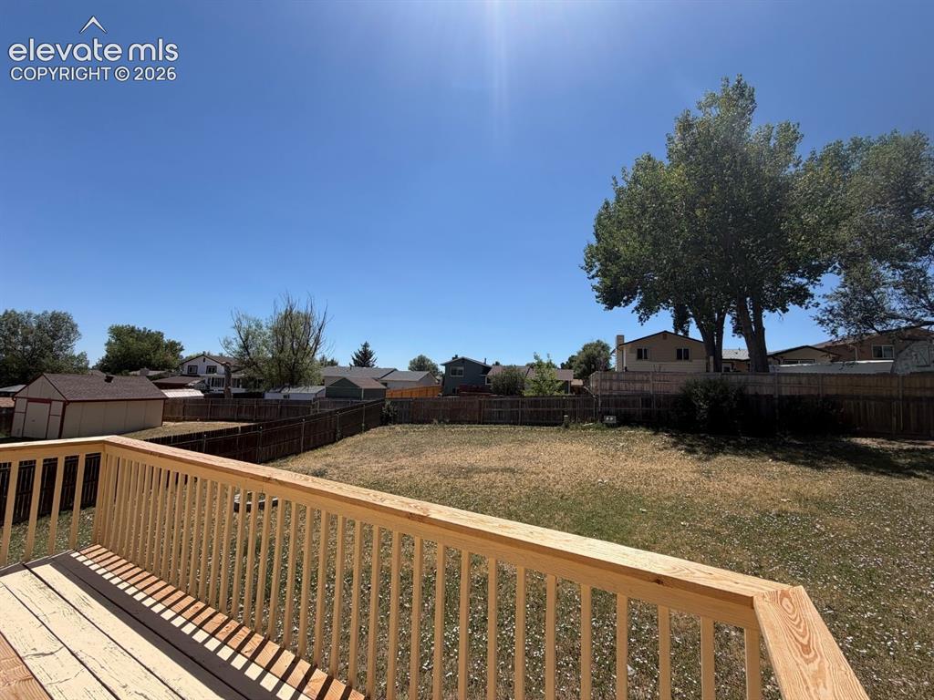 Image 15 of 18: Large wood deck providing a great outdoor living space
