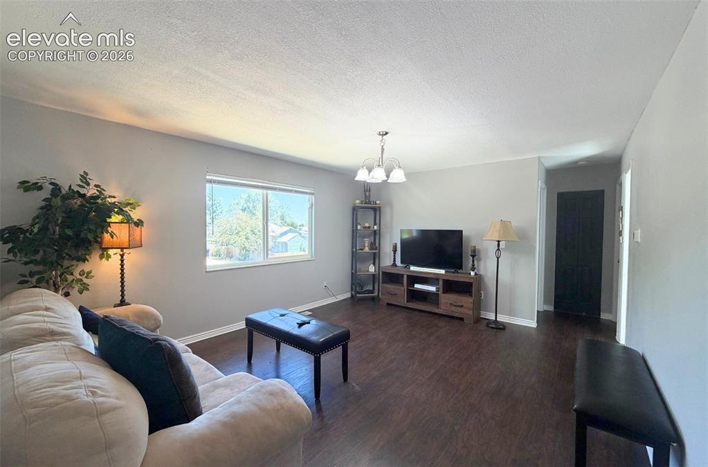 Image 4 of 18: Bright and inviting living room, perfect for everyday living and entertaini