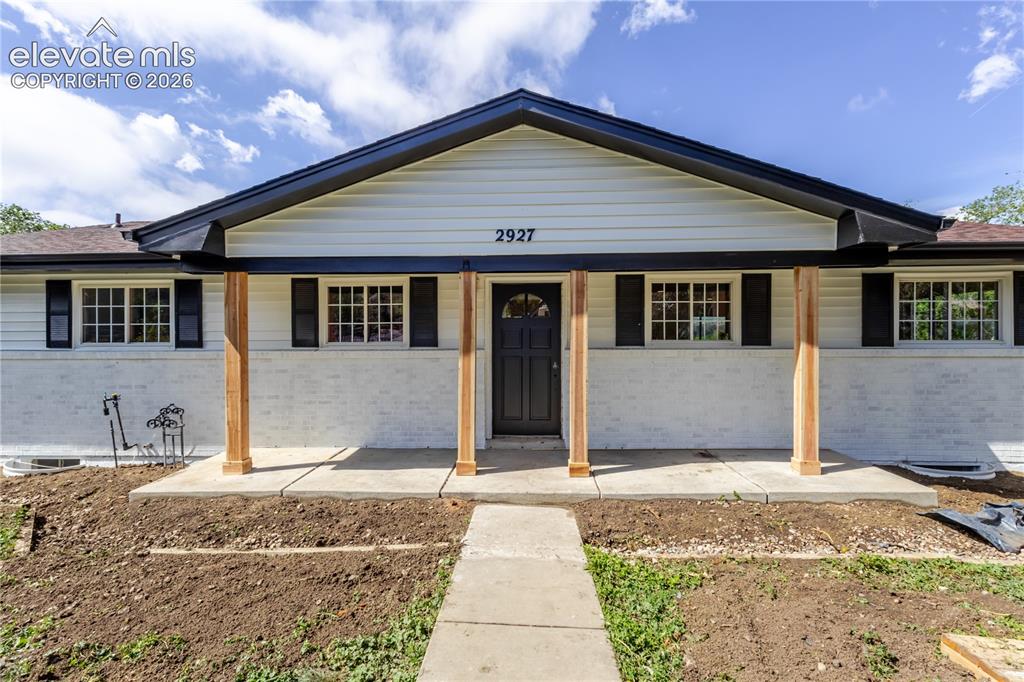 Image 1 of 47: Contemporary ranch-style exterior featuring white siding and painted brick