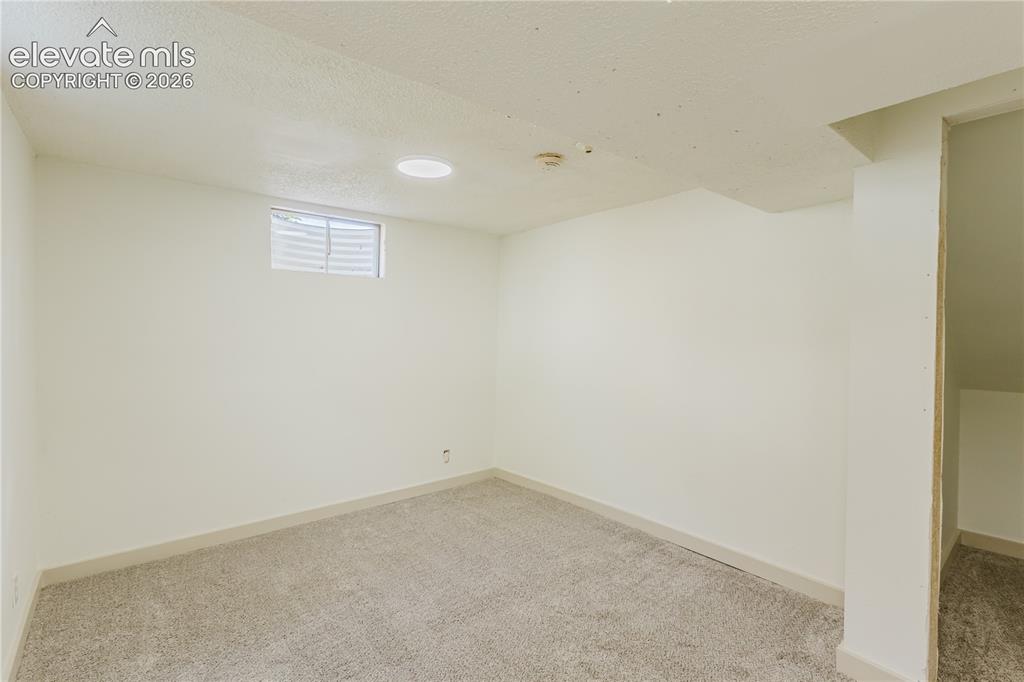 Image 30 of 47: Finished room featuring light-colored carpet, white walls, a recessed light