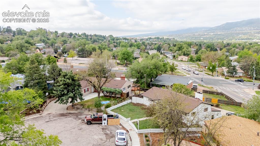 Image 33 of 47: Aerial overview of a residential neighborhood with varied architecture and