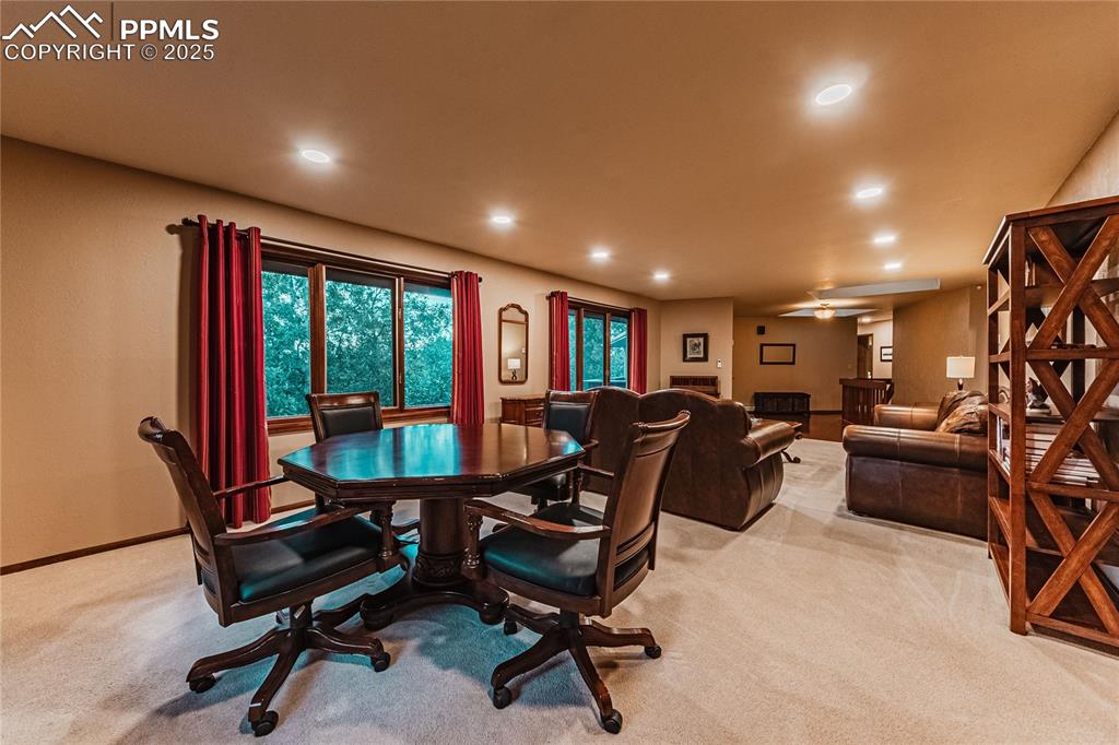 Image 11 of 39: Dining area with light carpet, recessed lighting, baseboards, and ceiling f