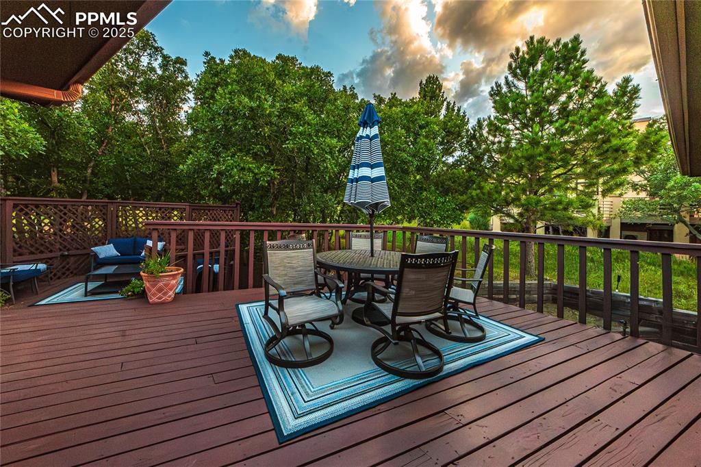 Image 30 of 39: Wooden deck featuring outdoor dining space
