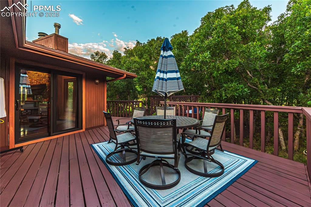 Image 31 of 39: Deck with outdoor dining space