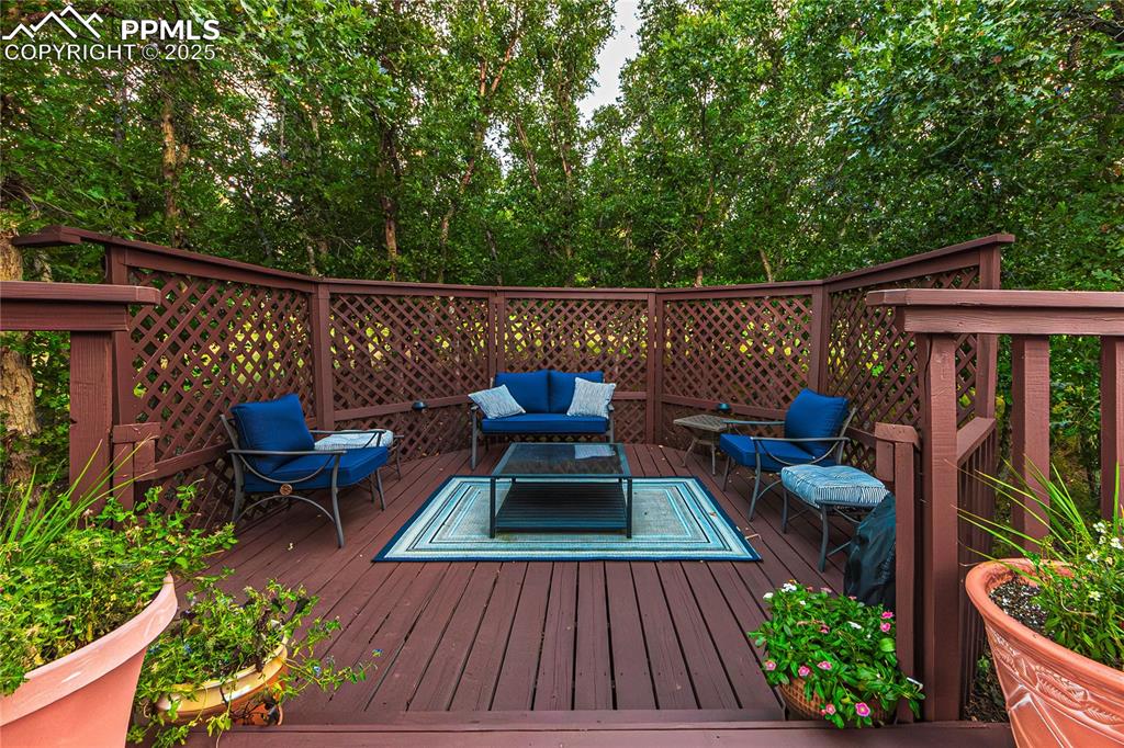 Image 34 of 39: Wooden terrace with outdoor lounge area