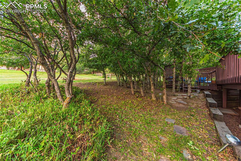 Image 39 of 39: View of yard with a deck