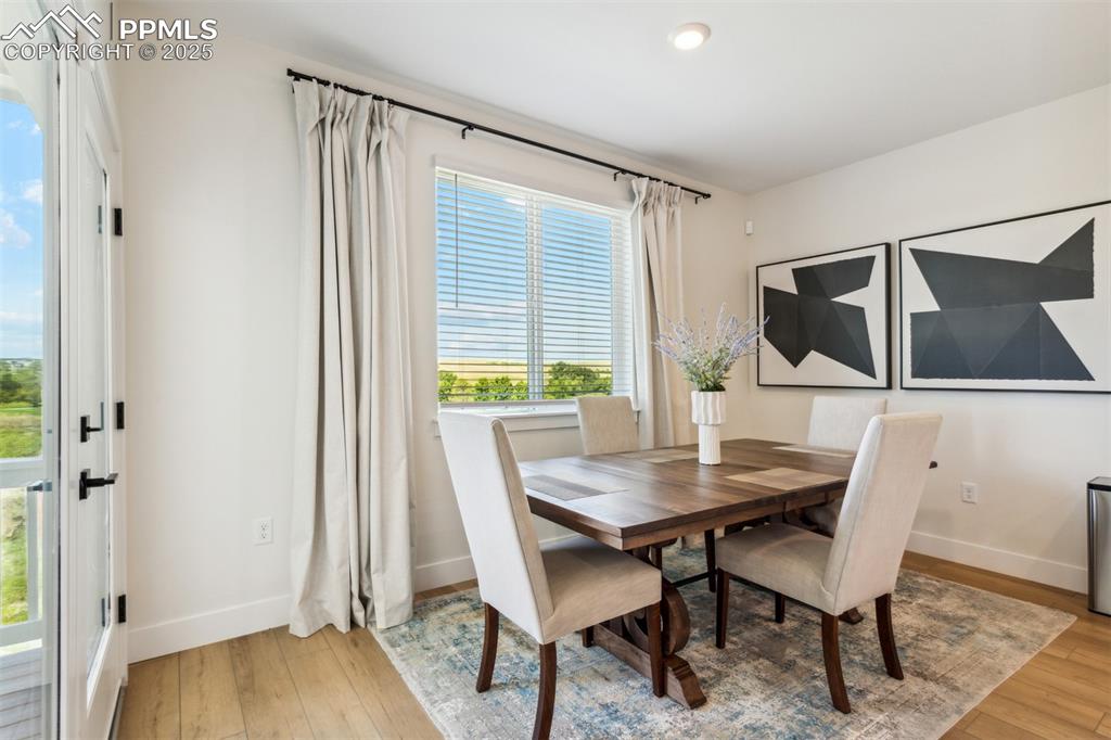 Image 10 of 23: Dining space with recessed lighting, light wood-style flooring, and baseboa
