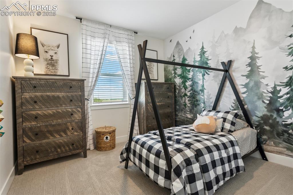 Image 15 of 23: Bedroom with carpet flooring