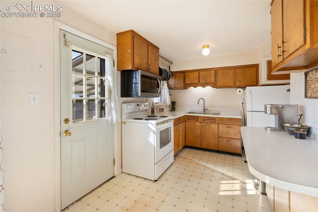 Image 11 of 24: Clean and usable kitchen space - update at your own pace