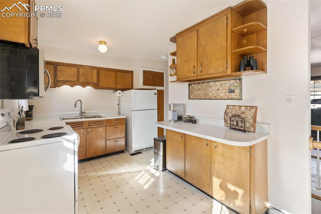 Image 12 of 24: Well maintained original  kitchen full of potential
