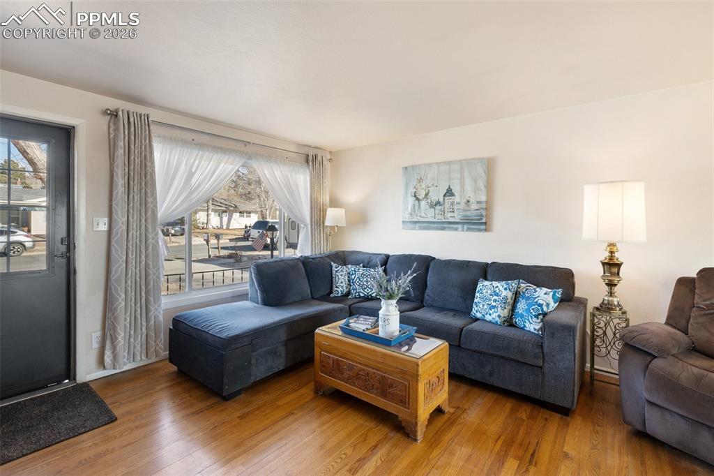 Image 2 of 24: Original hardwood flooring gives this home timeless charm