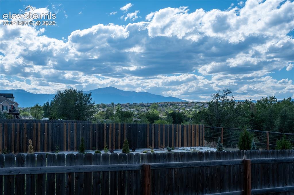 Image 23 of 31: Amazing Mountain view and Sand Creek open space from the backyard