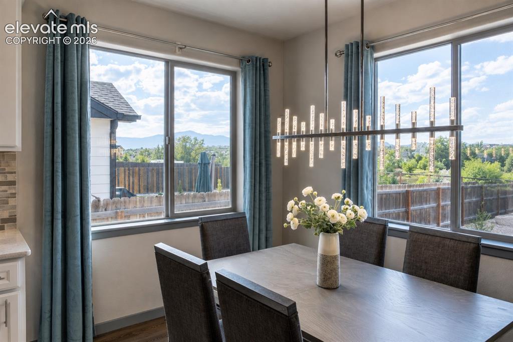 Image 6 of 31: Dining Room with beautiful mountain views
