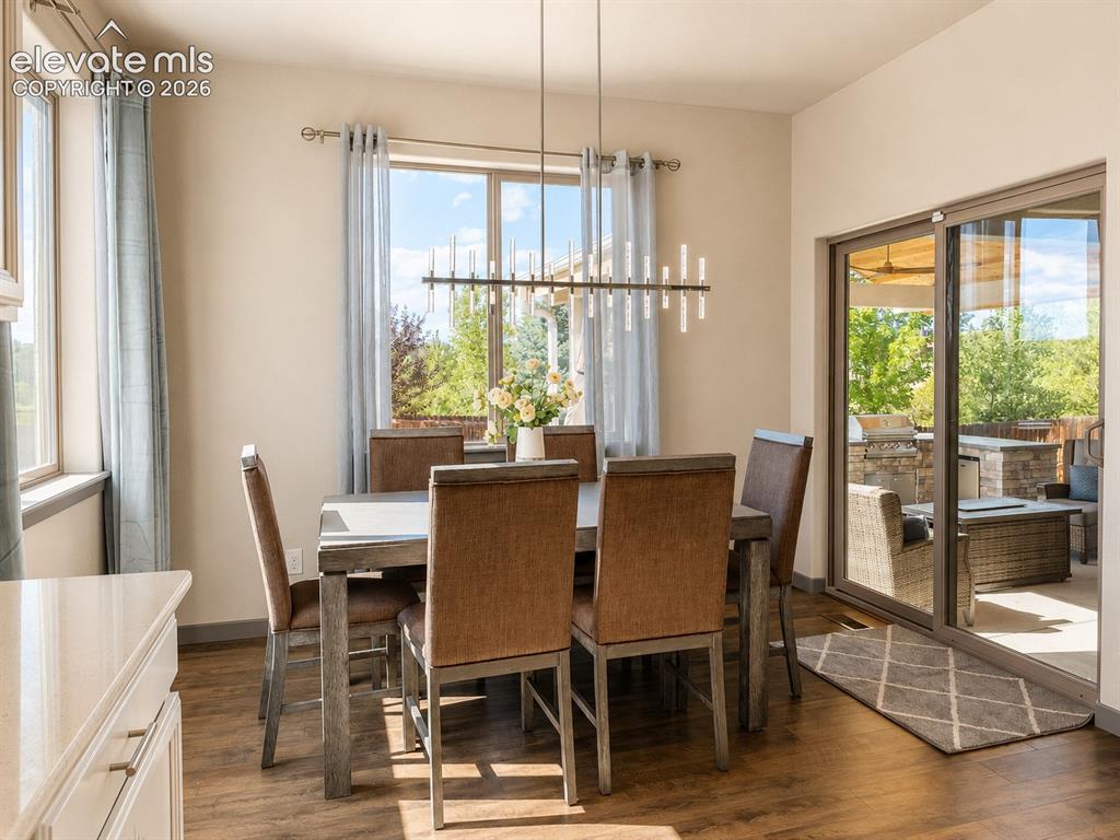 Image 7 of 31: Bright Dining Room with a walk out to the patio
